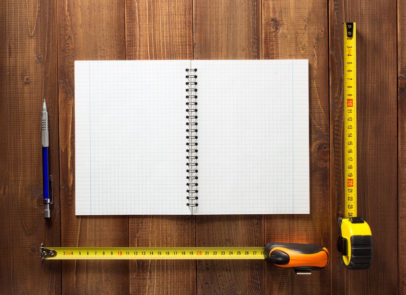 construction tools on wooden background